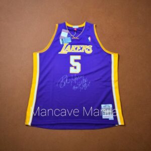 This Mitchell & Ness jersey is personally signed by Horry and inscribed with “Big Shot Bob 7× NBA Champ”, honoring his legacy as one of the most clutch players in NBA history.